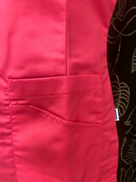 Zorgjas Livia gekleurd in lila, lime en fuchsia - Zorgkleding.nl