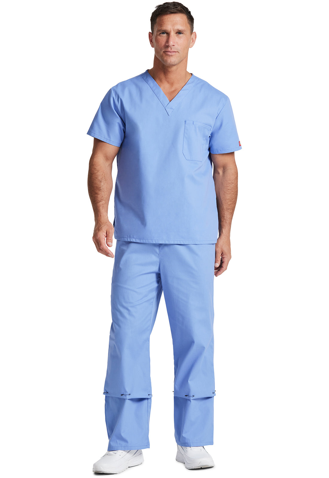 Unisex top met V-hals die in de broek gedragen kan worden met borstzak en zijsplitten