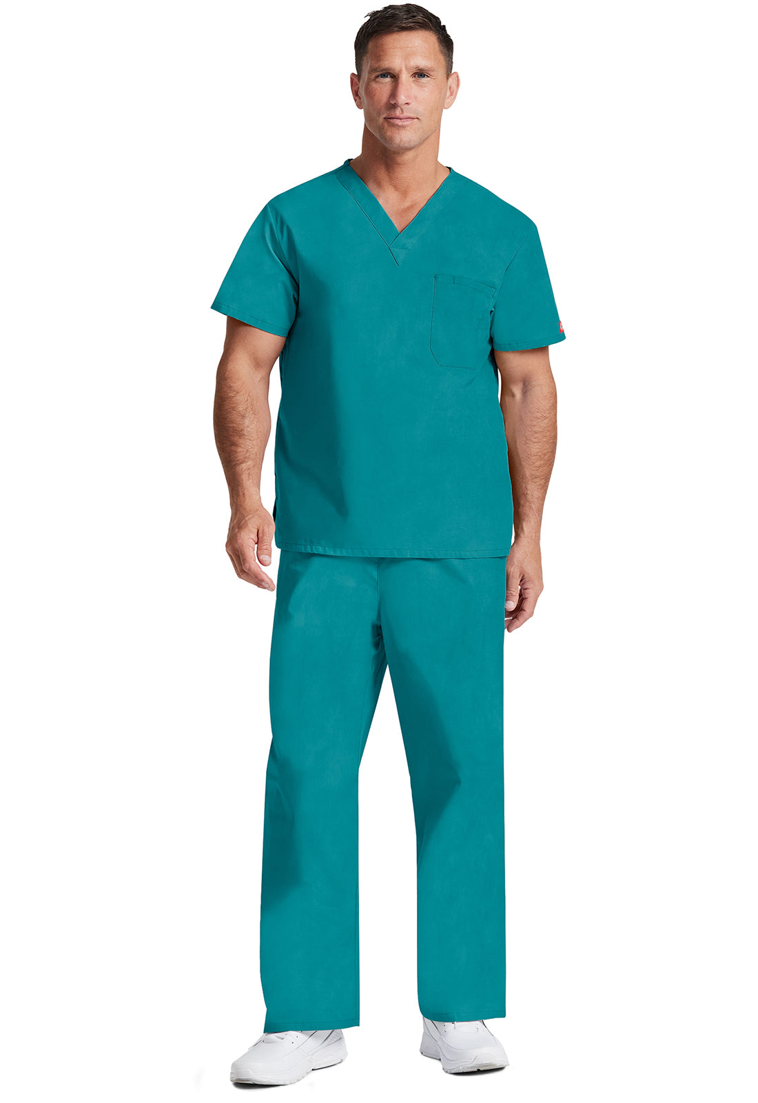 Unisex top met V-hals die in de broek gedragen kan worden met borstzak en zijsplitten