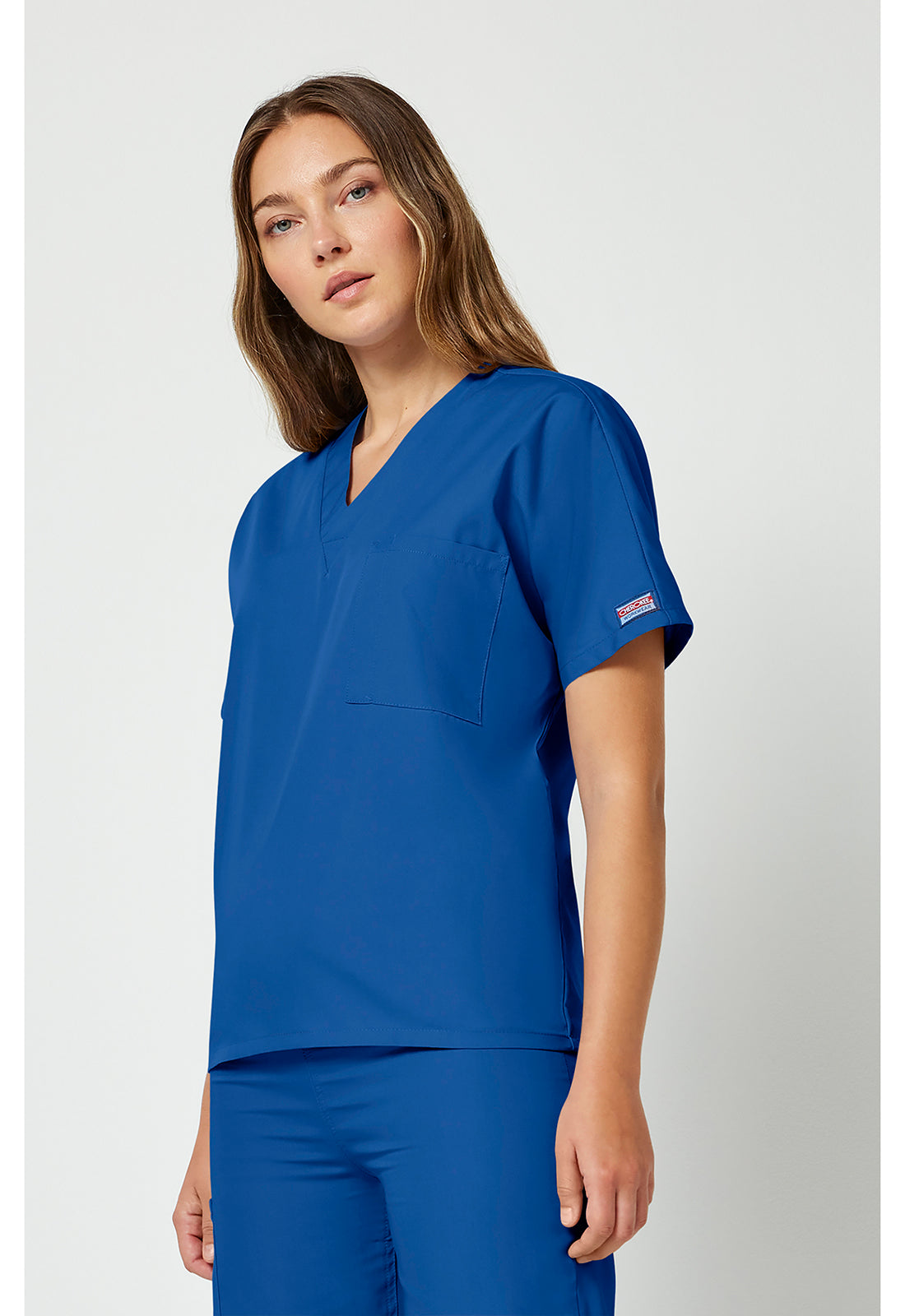 Unisex tuniek met V-hals met vleermuismouwen en borstzak WWE4777