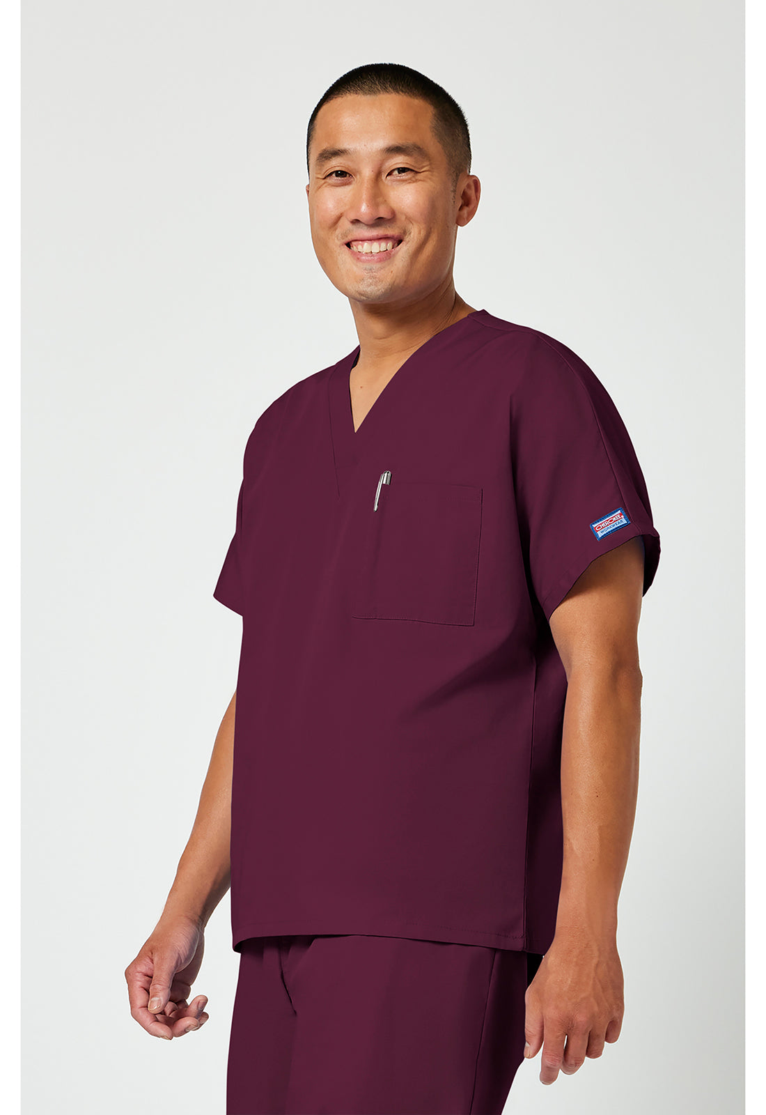 Unisex tuniek met V-hals met vleermuismouwen en borstzak WWE4777