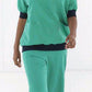 OK-omlooptuniek Andreas groen - Zorgkleding.be